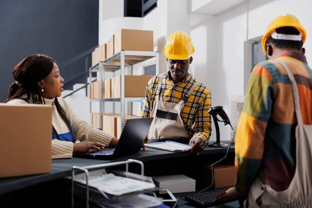 How to Import, Export Goods imgi 144 shipment manager asking warehouse workers about merchandise storage system african american storehouse employees talking using inve