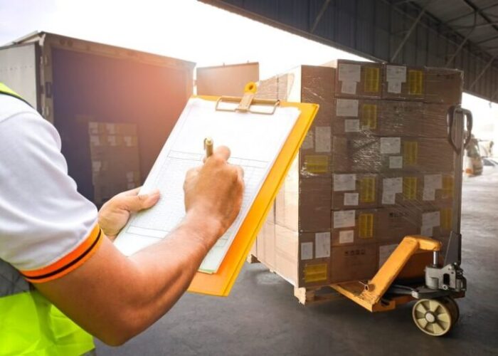 imgi 25 warehouse worker holding clipboard is ckecking load package boxes delivery shipment boxes 36860 1147